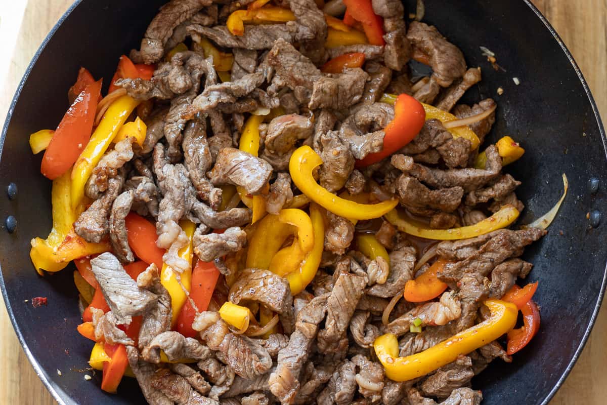 the sautéed beef is returned to the pan