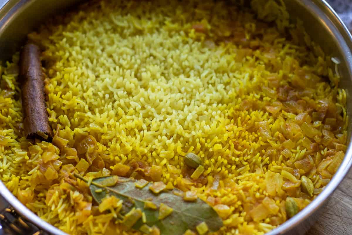 yellow Indian rice is left to rest after cooking