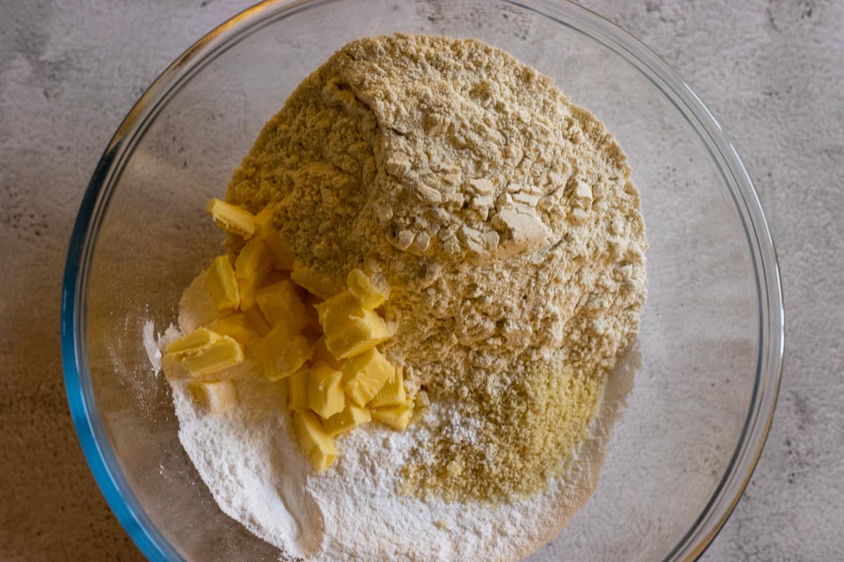 the flour, almond flour, butter and salt are placed in a bowl