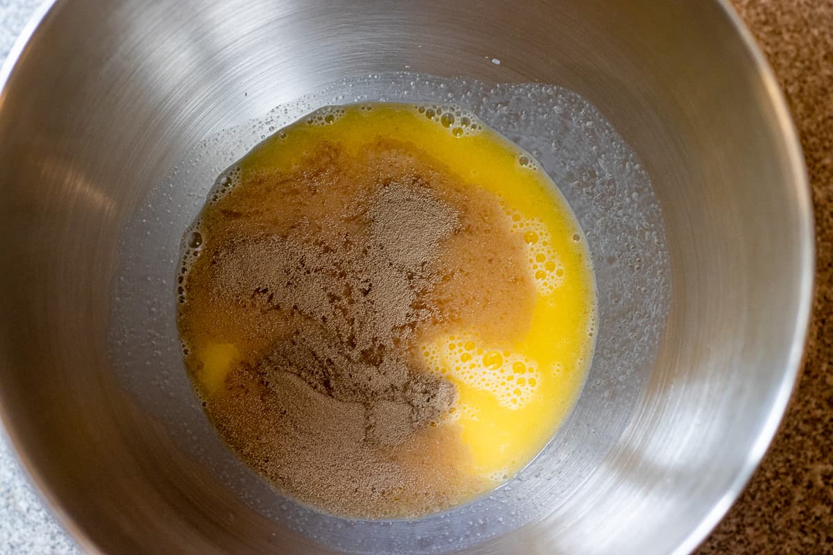 melted butter, milk and yeast are placed in a bowl of a stand mixer