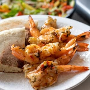 bbq prawns served with bread and salad