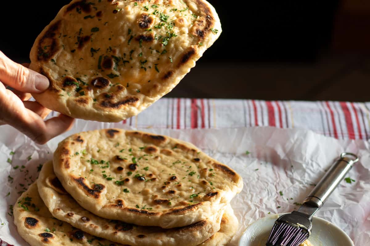 4 pieces of garlic naan brushed with ghee 