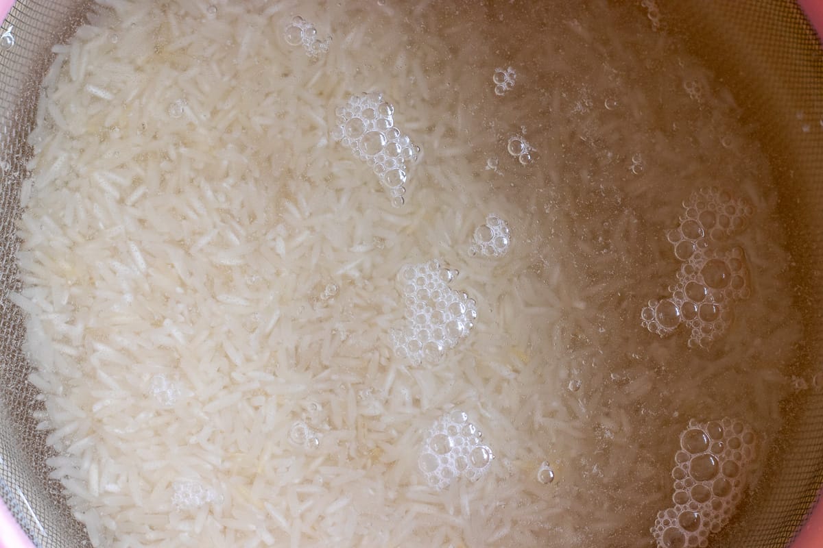 rice is washed and soaked in cold water