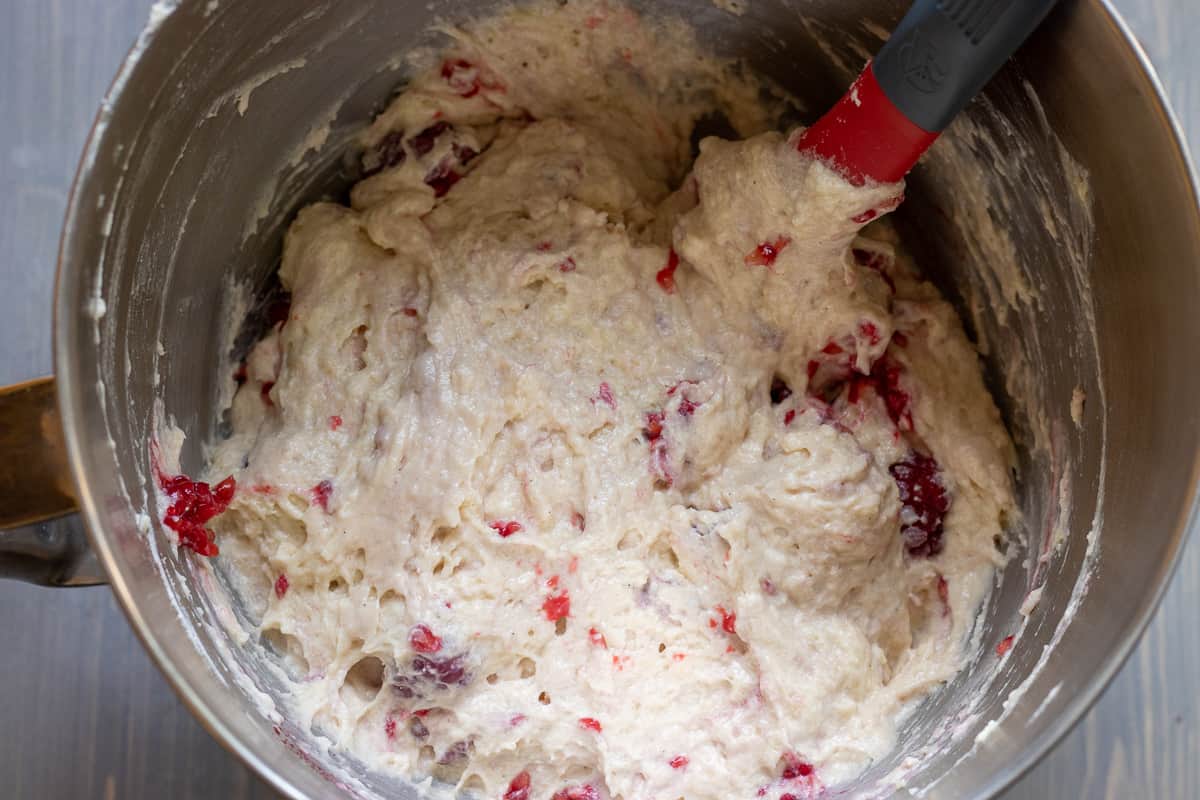 folding in the raspberries to the cake mixture