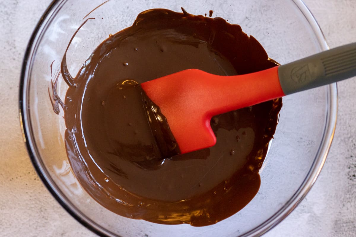 melted dark chocolate in a glass bowl