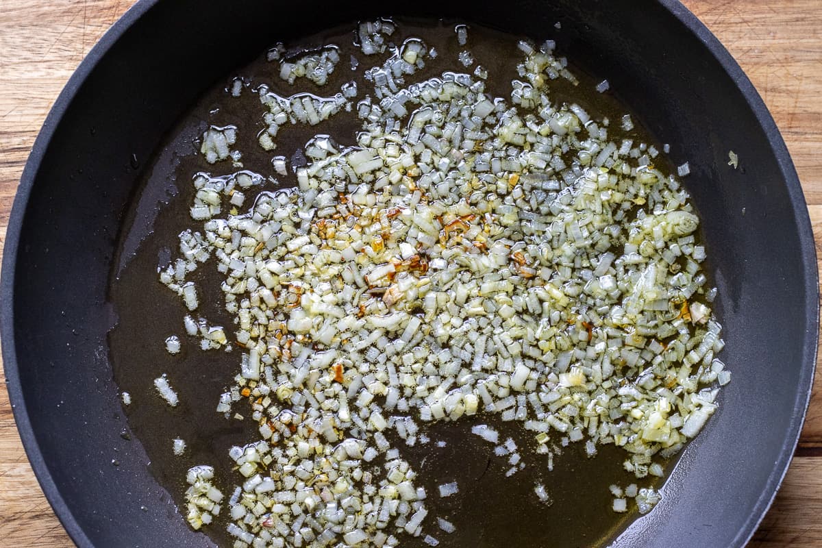 sautéing the shallots and pine nuts in olive oil for making the stuffing for vegetarian stuffed mushrooms