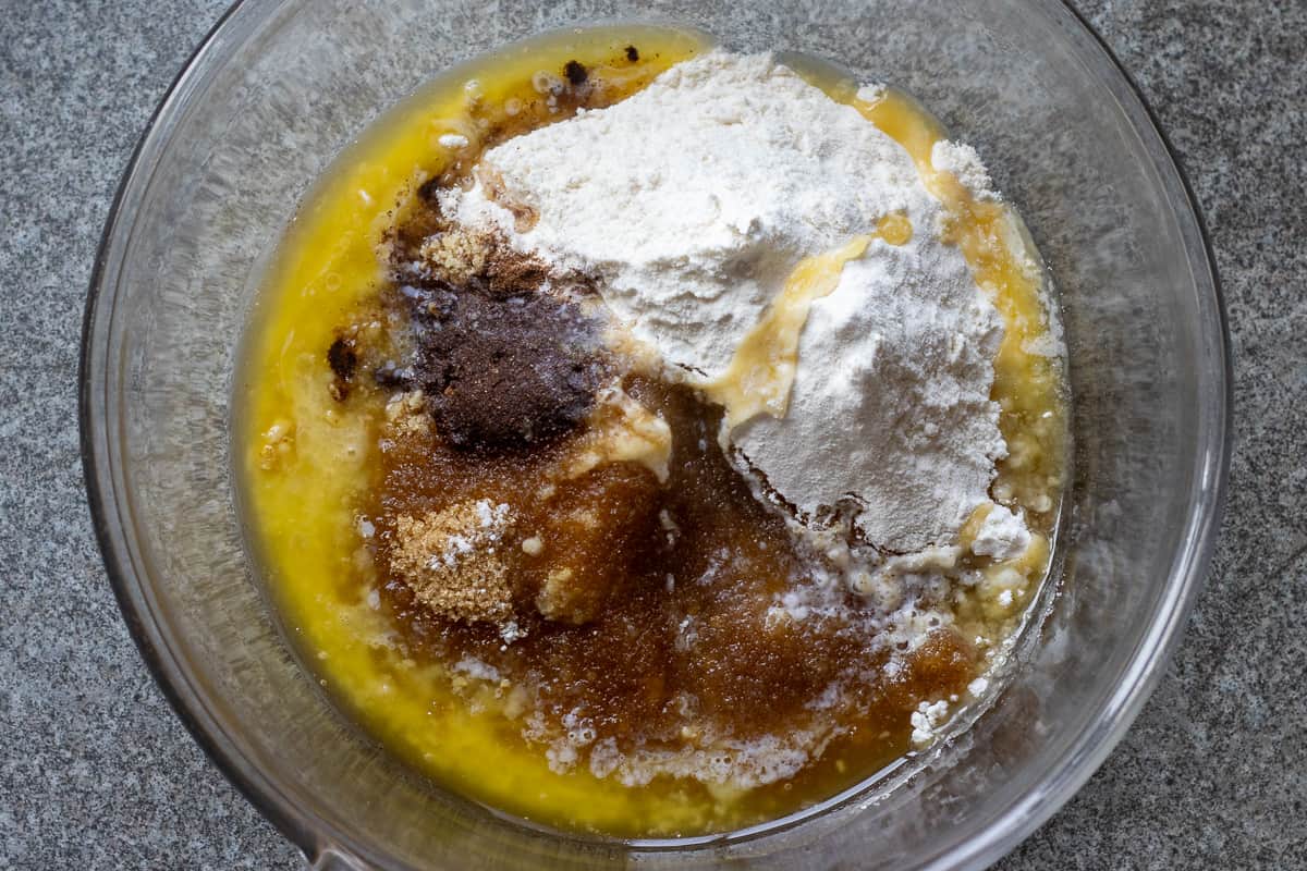 flour, melted butter, cinnamon, walnuts, and sugar are placed in a glass bowl