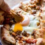 cheese and mushroom pide topped with an egg
