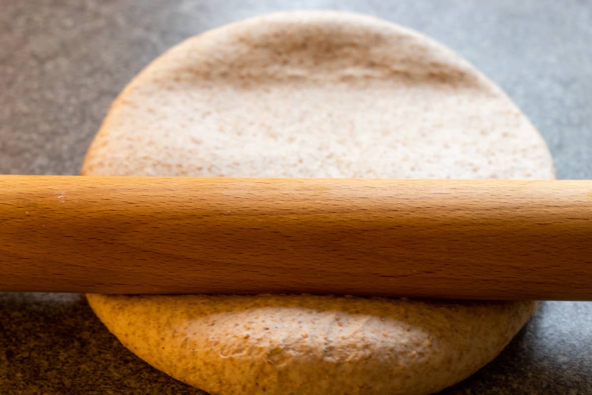 Rolling the dough out into a rectangular with a rolling pin