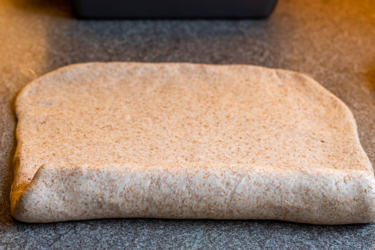 rolling the dough into a log shape