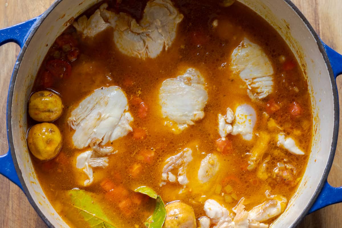 the stock and chicken pieces are added to the pan
