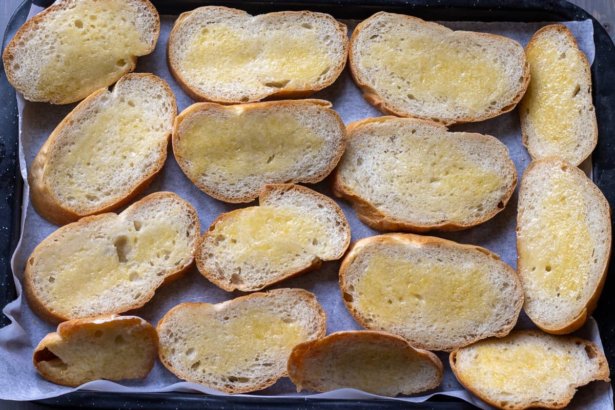 slices of bolillo covered with butter