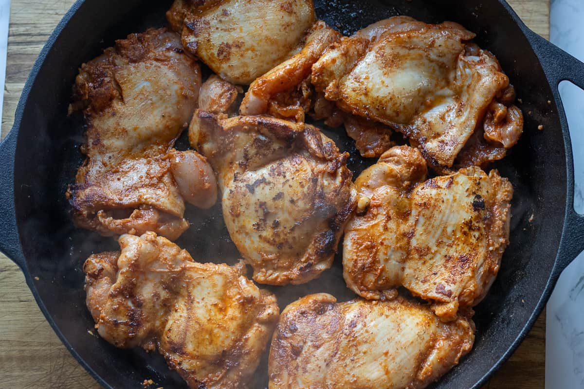 browning chicken thighs in a skillet