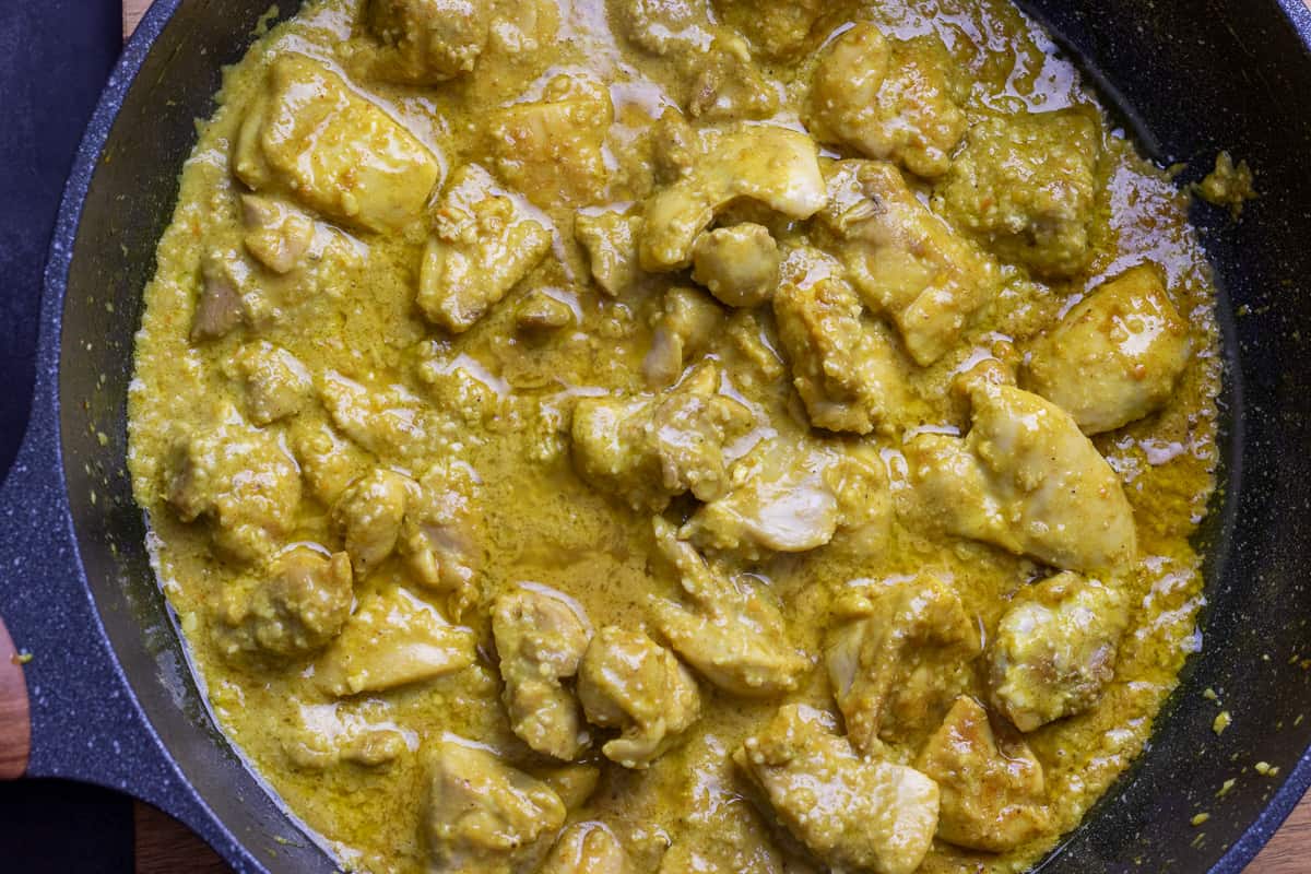 sautéed chicken pieces are cooked in creamy sauce