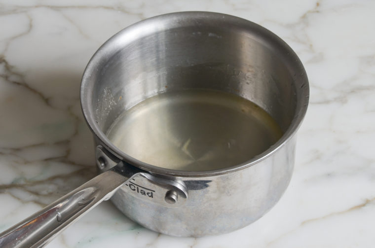 Water, sugar, and salt mixture in a sauce pan.