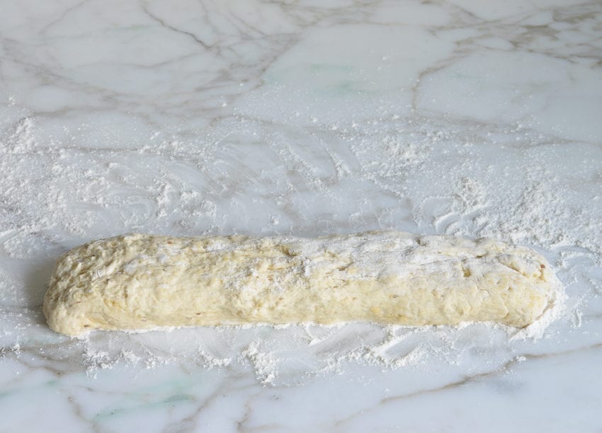 Rectangle of dough on a counter.